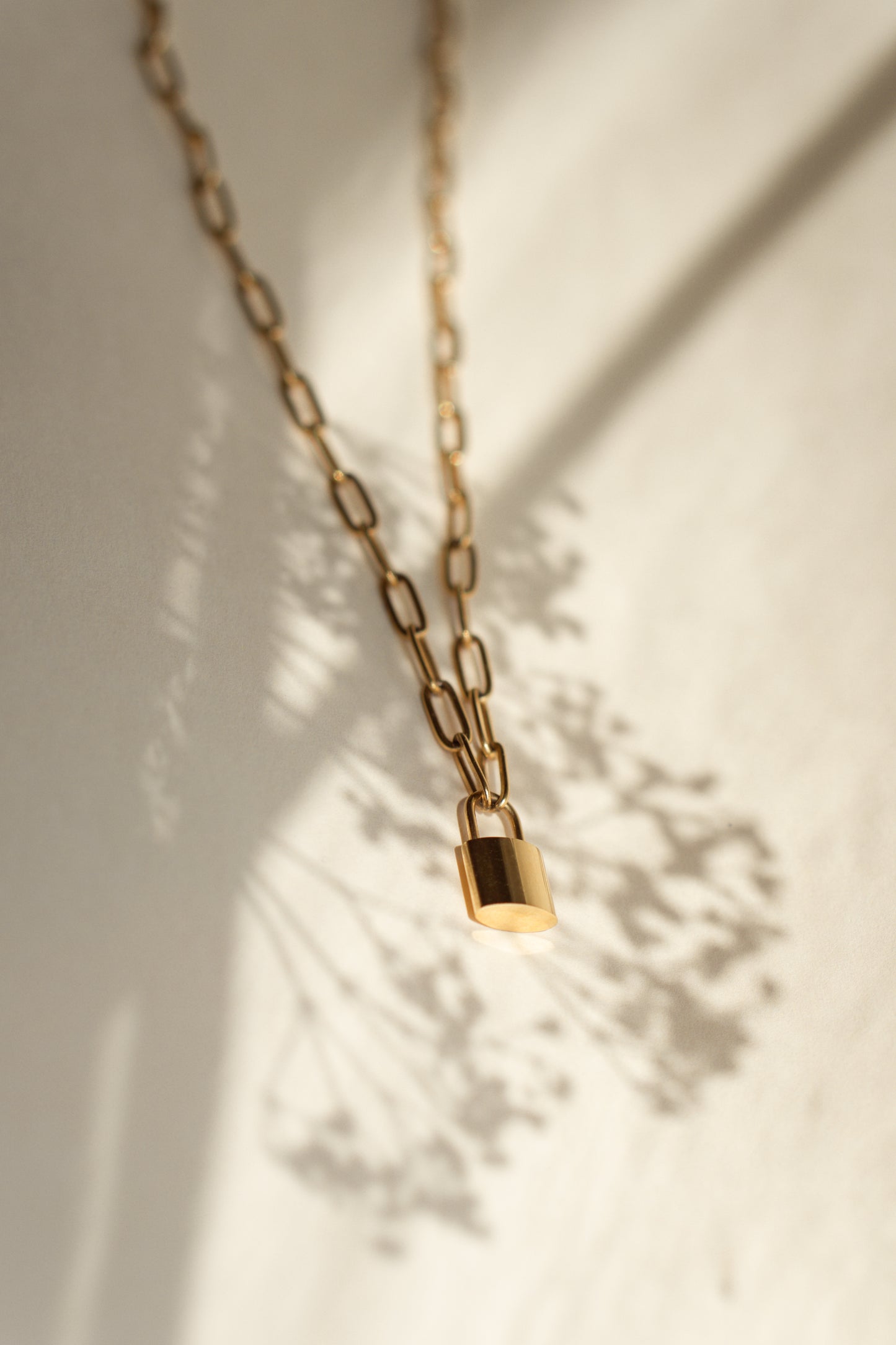 Gold paperclip chain necklace padlock pendant