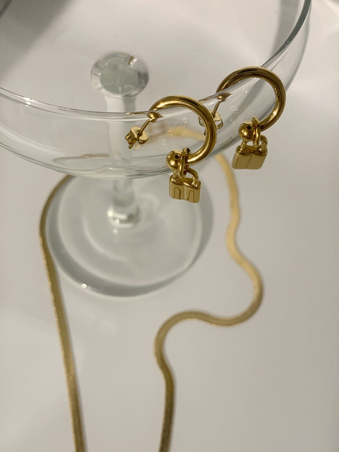 Paris Padlock Huggie Hoops, gold padlock huggie earrings, view 2